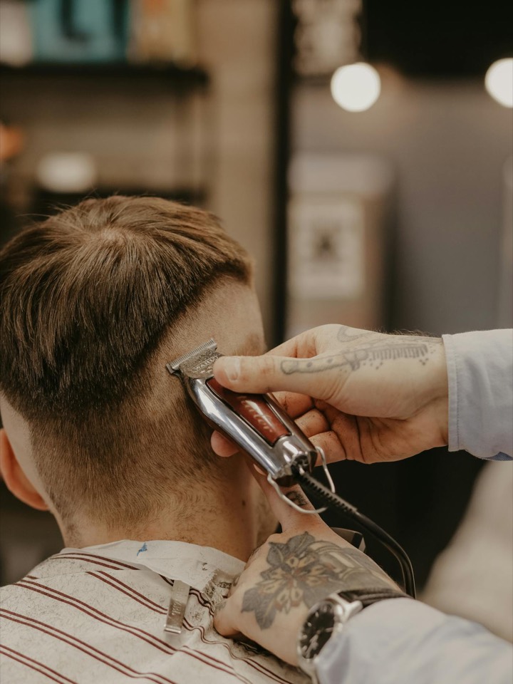 Close-up of a low skin fade haircut in a barber chair