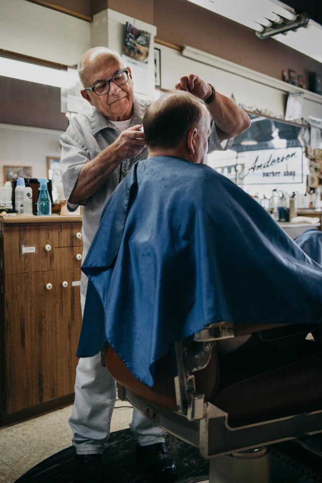Barber finishing a textured crop style